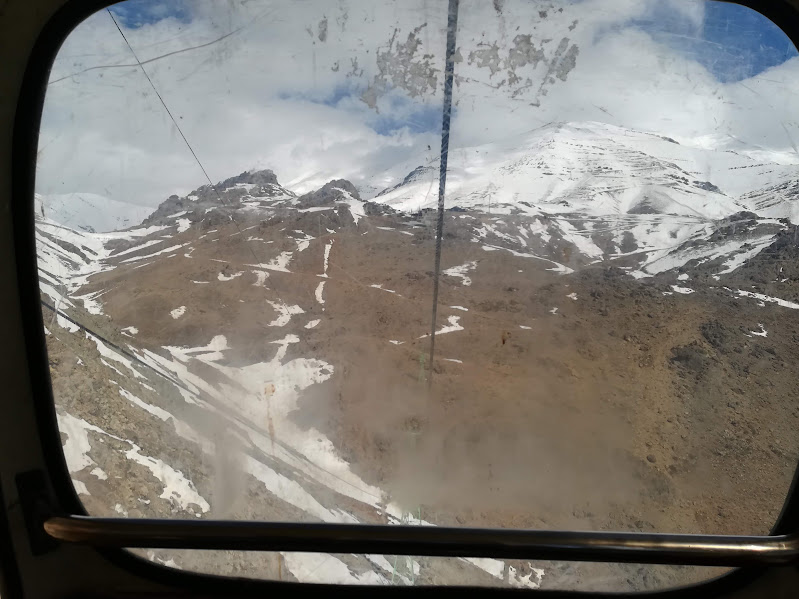 View of snowy mountains from a cable car