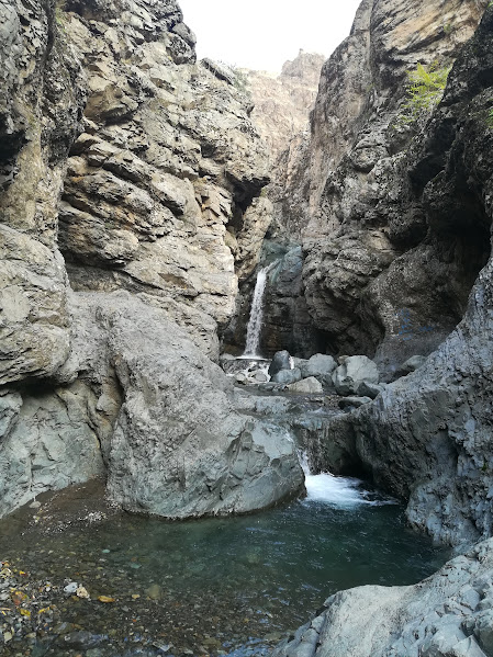 Waterfall in a rocky canyon